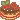 Floating pixel art cake with cherry filling and chocolate frosting.