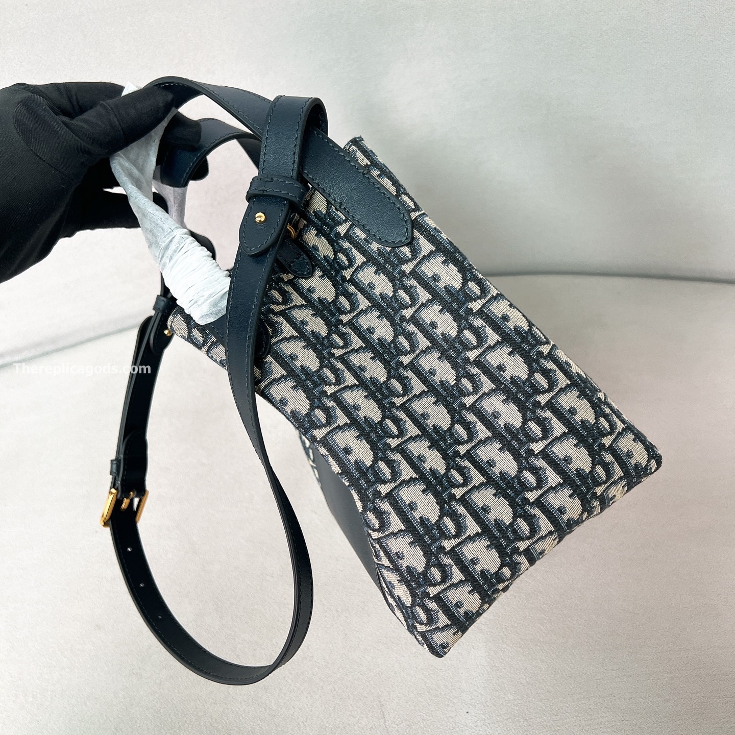 SMALL SIGNATURE BUCKET BAG BLUE OBLIQUE JACQUARD AND SMOOTH CALFSKIN