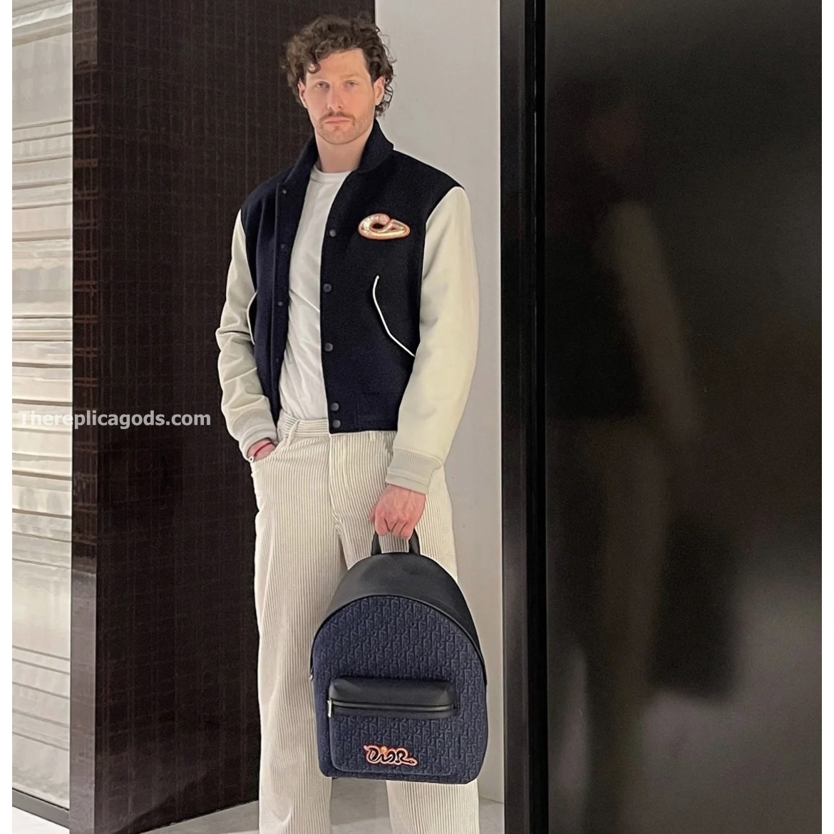 AND KAWS RIDER 2.0 ZIPPED BACKPACK NAVY BLUE GRAINED CALFSKIN AND OBLIQUE JACQUARD