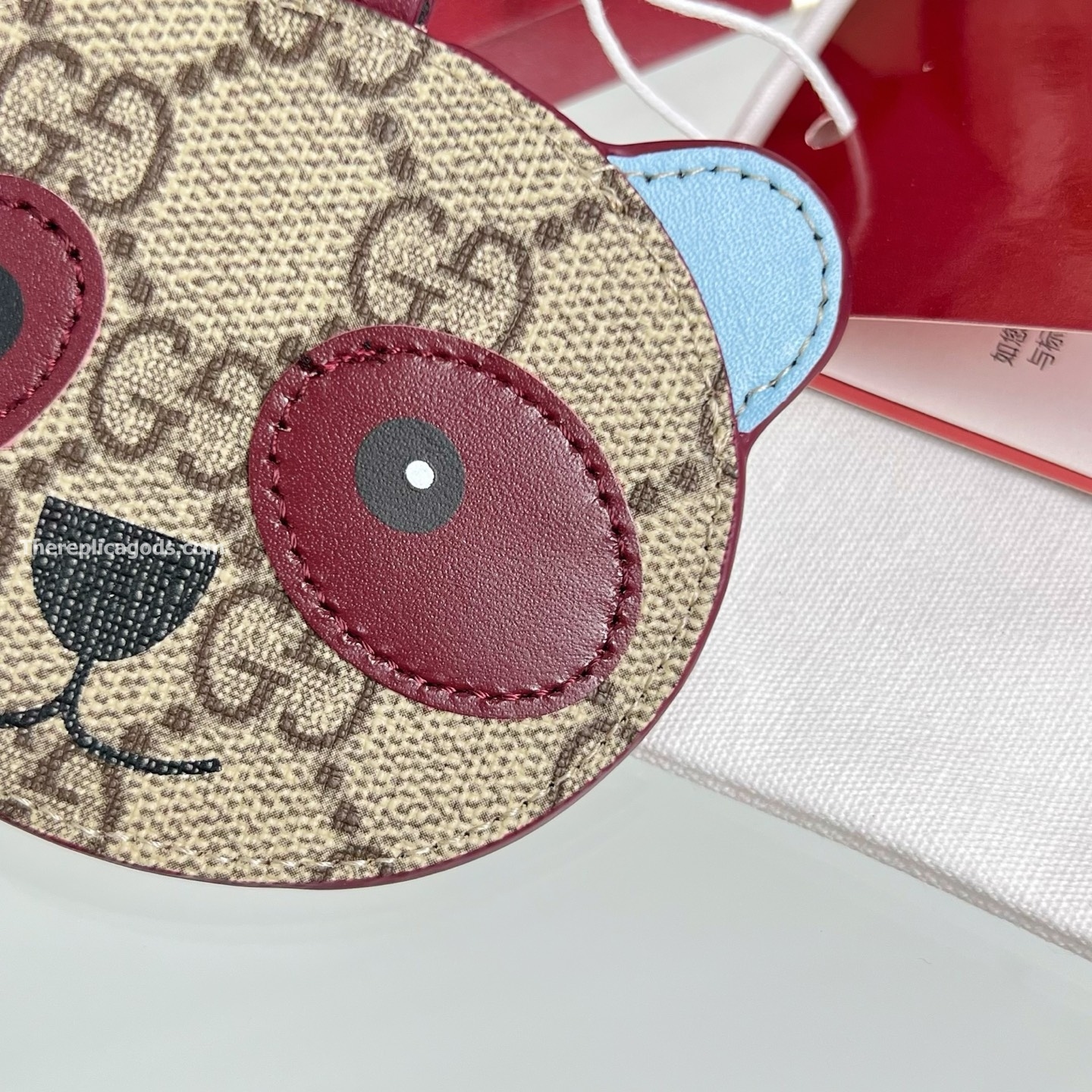 PANDA-SHAPED BAG CHARM BEIGE AND DARK BROWN NEW GG MONOGRAM CANVAS
