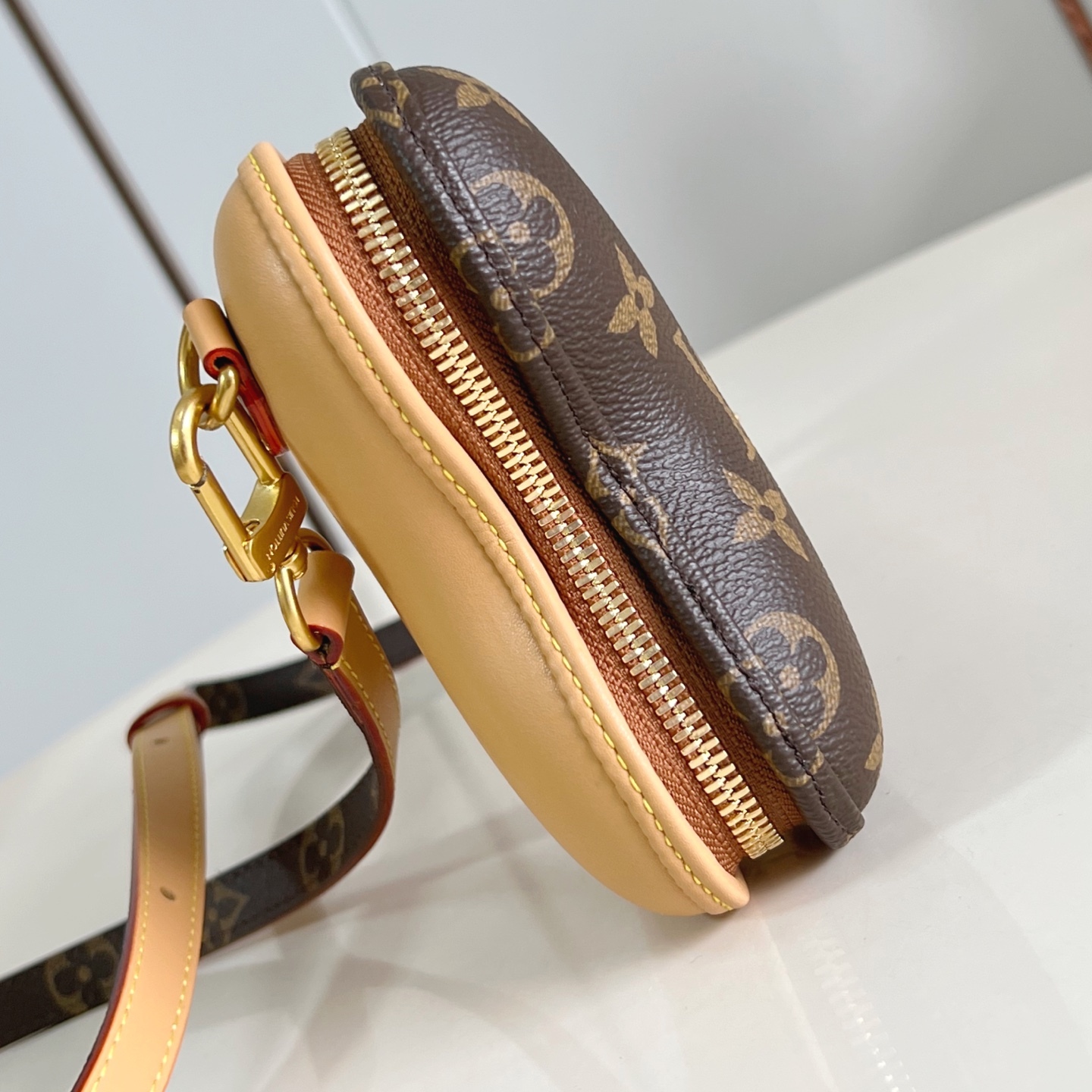 BONE WEARABLE WALLET BROWN MONOGRAM CANVAS M12615