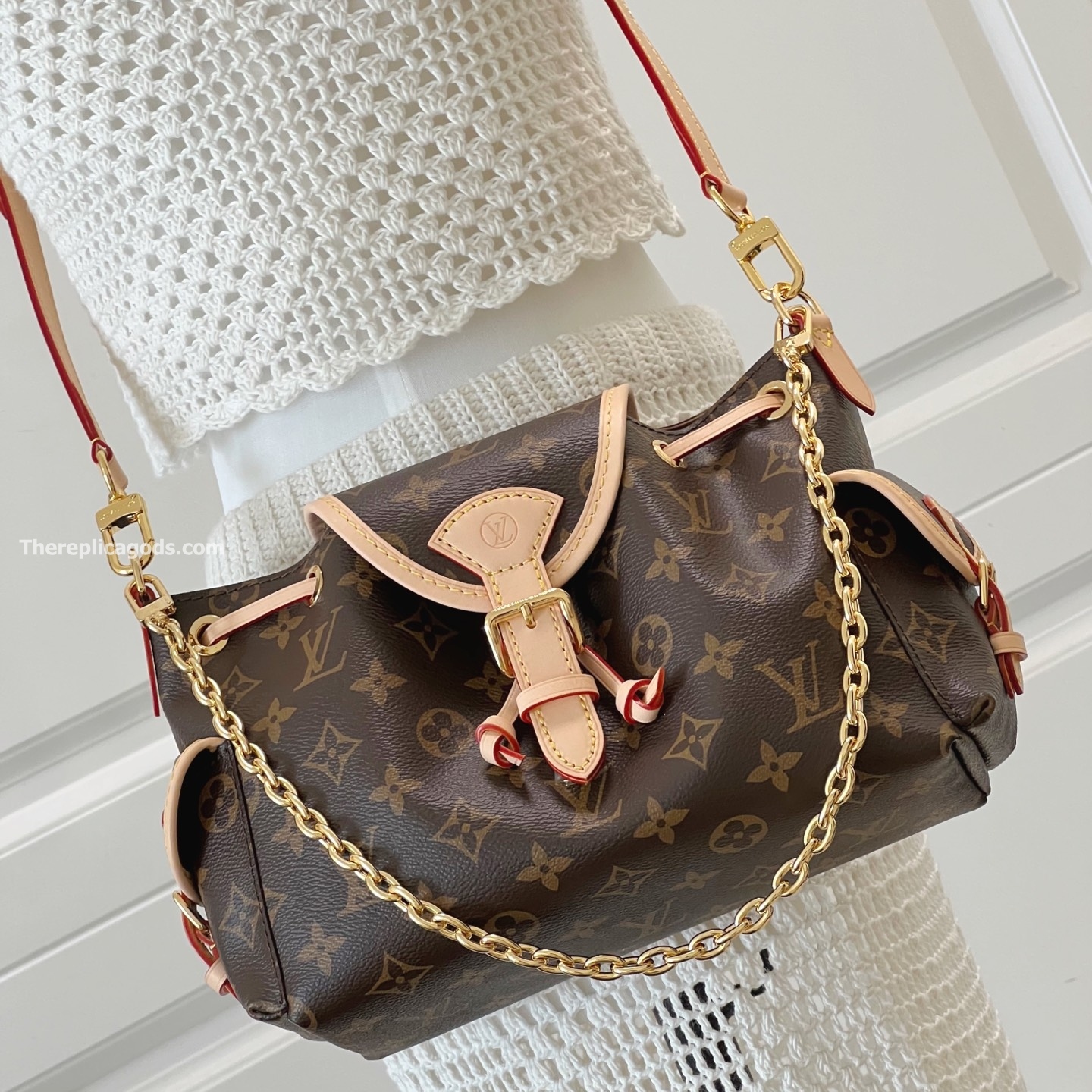 ODYSSEE HANDBAG BROWN MONOGRAM CANVAS M25085