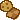 A circular cookie and a checkerboard cookie floating together.