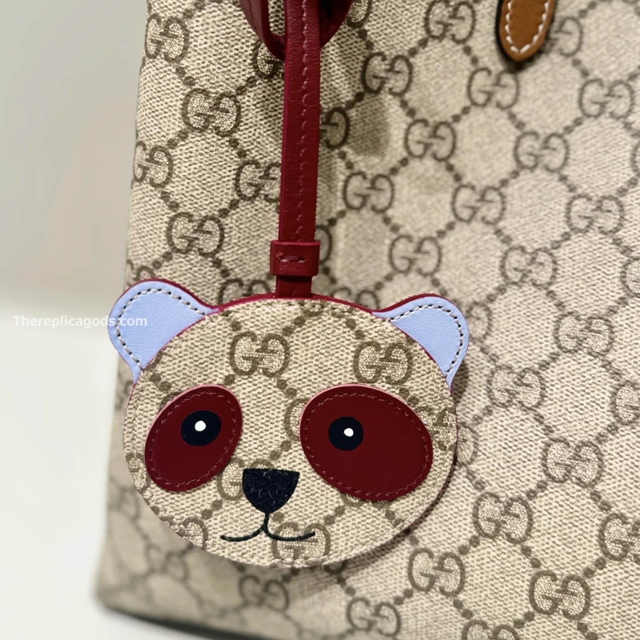 PANDA-SHAPED BAG CHARM BEIGE AND DARK BROWN NEW GG MONOGRAM CANVAS