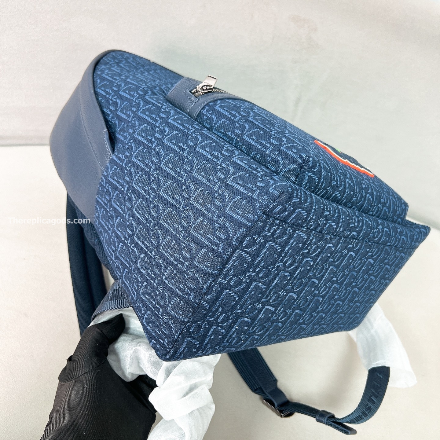 AND KAWS RIDER 2.0 ZIPPED BACKPACK NAVY BLUE GRAINED CALFSKIN AND OBLIQUE JACQUARD