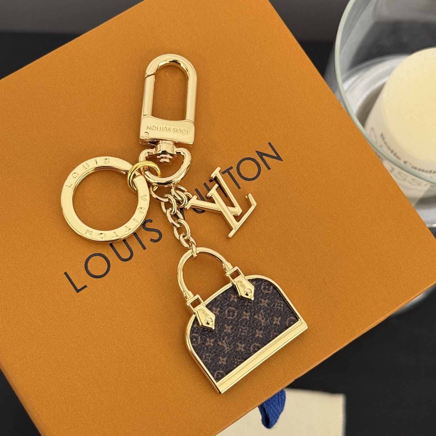 ALMA BAG CHARM METAL WITH GOLD-COLOUR FINISH M01799