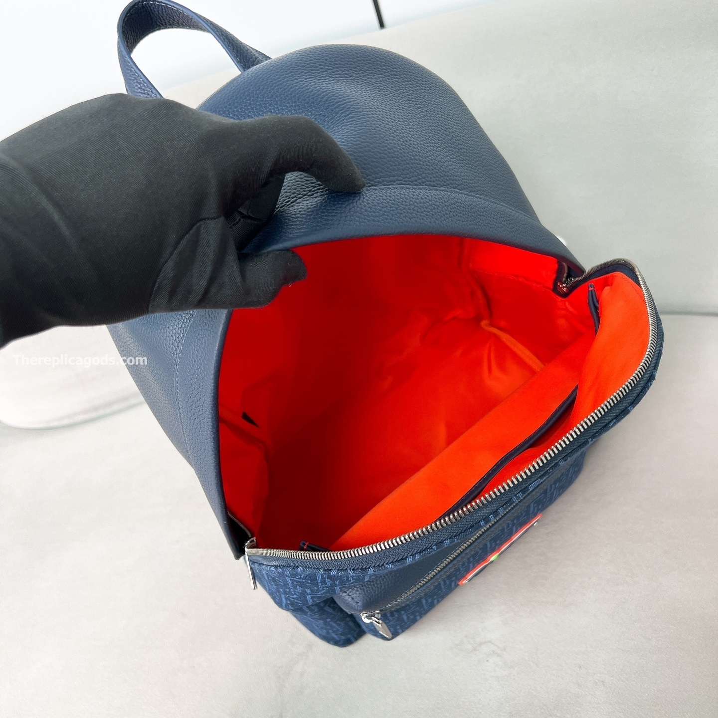 AND KAWS RIDER 2.0 ZIPPED BACKPACK NAVY BLUE GRAINED CALFSKIN AND OBLIQUE JACQUARD
