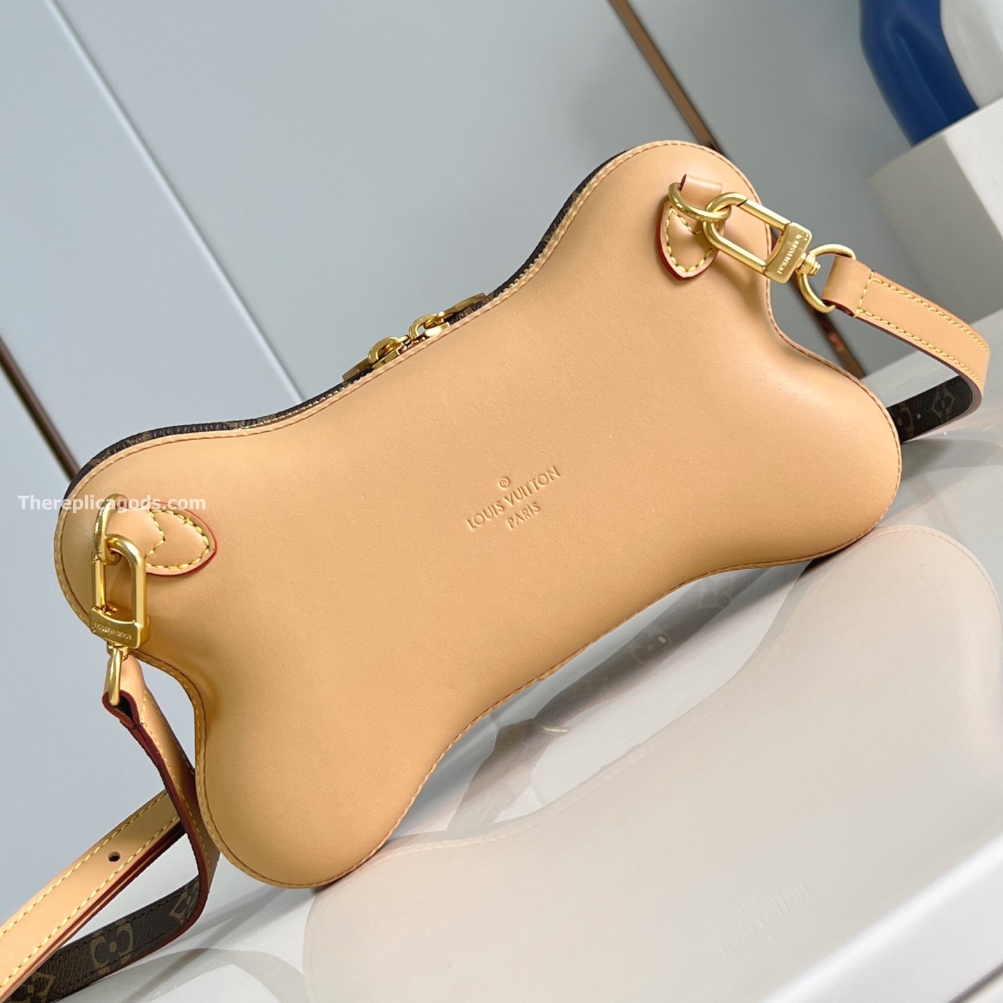 BONE WEARABLE WALLET BROWN MONOGRAM CANVAS M12615