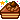 Floating pixel art layer cake with brown frosting and sparkles.
