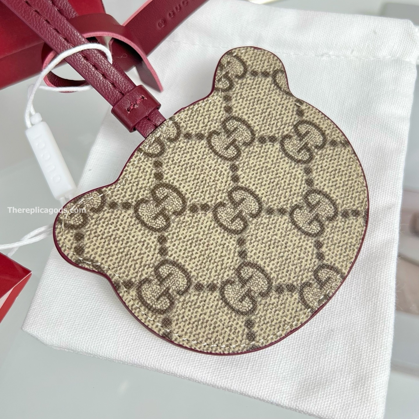 PANDA-SHAPED BAG CHARM BEIGE AND DARK BROWN NEW GG MONOGRAM CANVAS