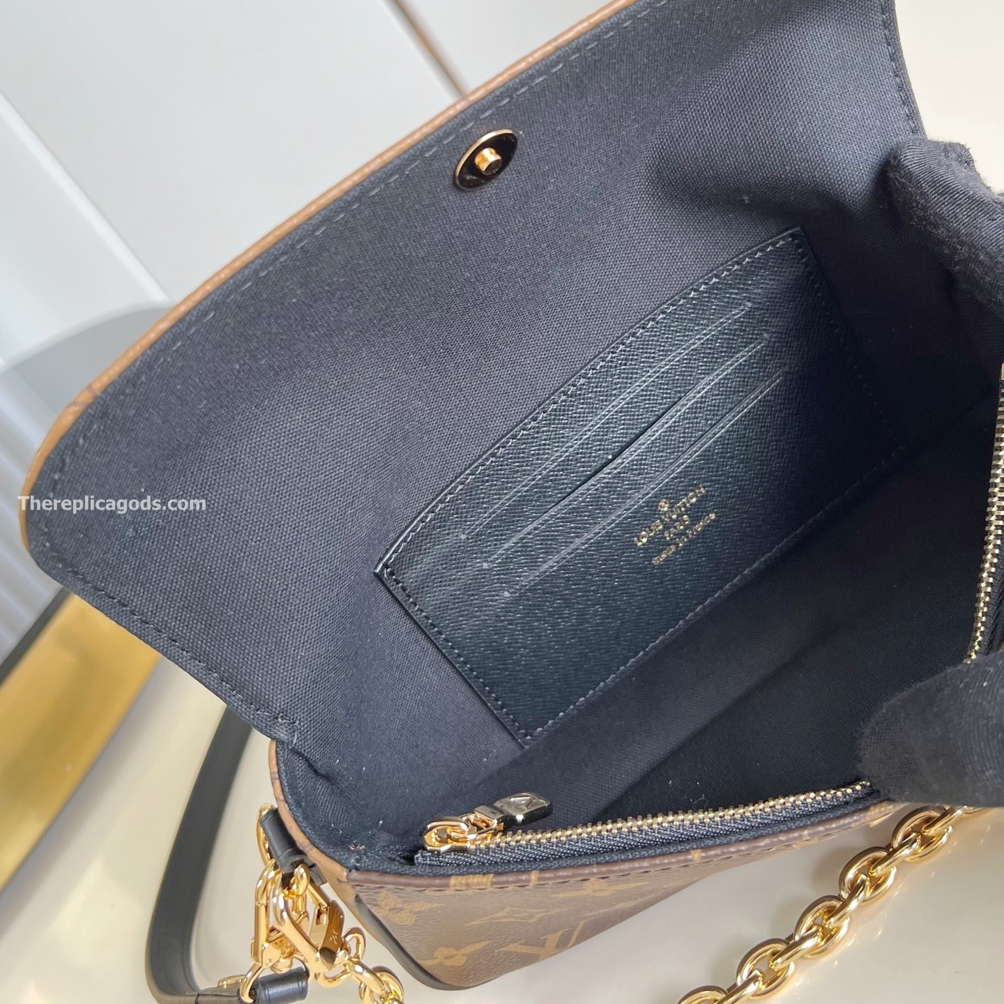 WALLET ON CHAIN IVY BROWN MONOGRAM REVERSE COATED CANVAS M26587