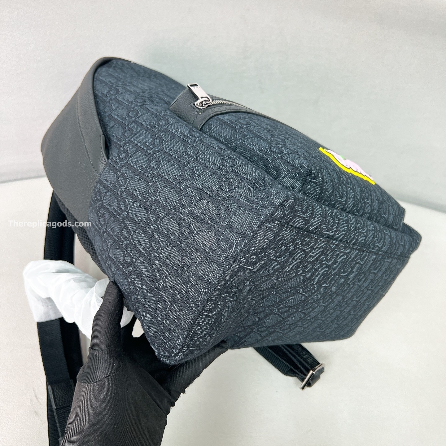 AND KAWS RIDER 2.0 ZIPPED BACKPACK BLACK GRAINED CALFSKIN AND OBLIQUE JACQUARD