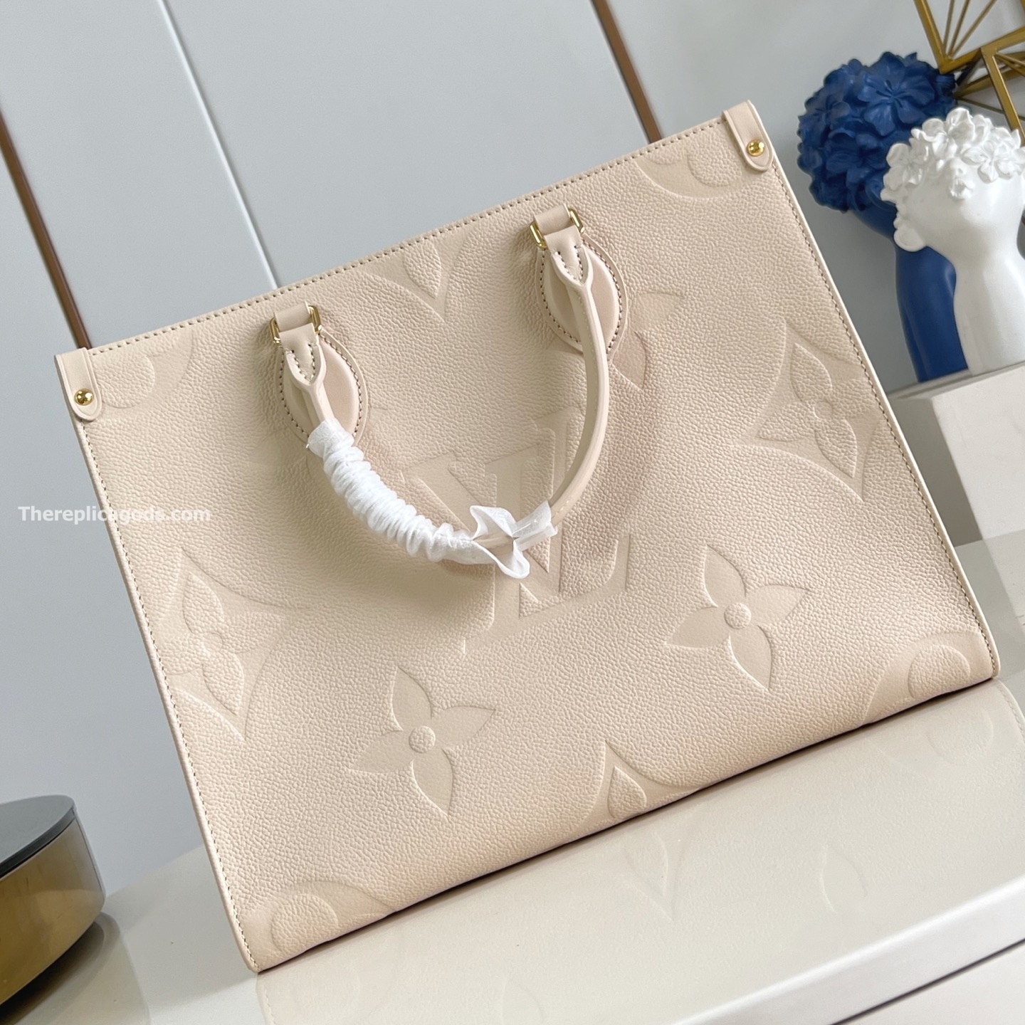 ONTHEGO MM BAG CREAM MONOGRAM EMPREINTE M46531