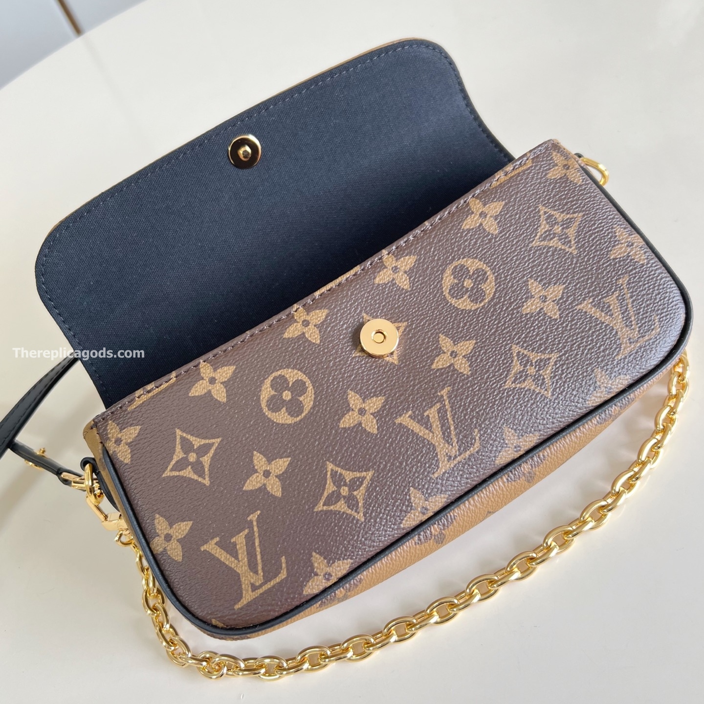 WALLET ON CHAIN IVY BROWN MONOGRAM REVERSE COATED CANVAS M26587