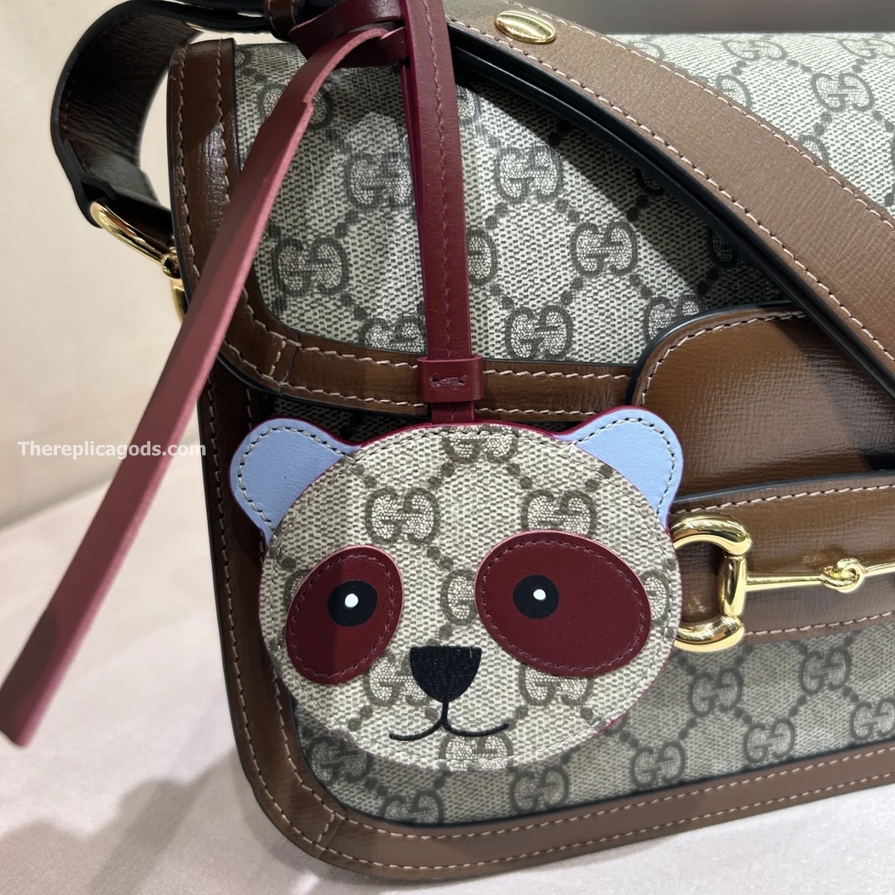 PANDA-SHAPED BAG CHARM BEIGE AND DARK BROWN NEW GG MONOGRAM CANVAS