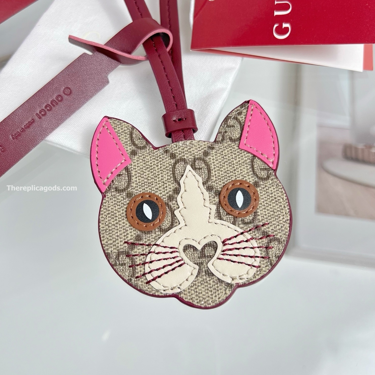 CAT-SHAPED BAG CHARM BEIGE AND DARK BROWN NEW GG MONOGRAM CANVAS