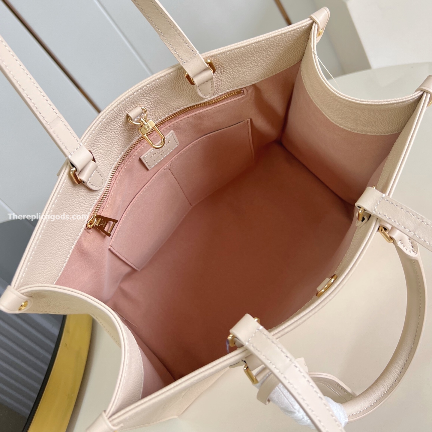 ONTHEGO MM BAG CREAM MONOGRAM EMPREINTE M46531