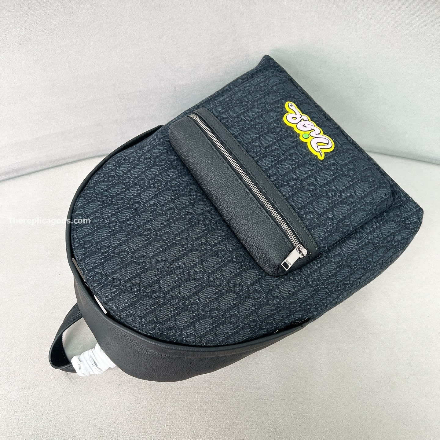 AND KAWS RIDER 2.0 ZIPPED BACKPACK BLACK GRAINED CALFSKIN AND OBLIQUE JACQUARD