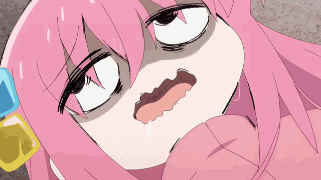 A moving image of the anime Bocchi The Rock where the main character,
          an anime girl with pink hair is on the floor having an anxiety/panic attack