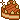 Pixel art caramel cake with brown frosting and a sparkle to the top left.