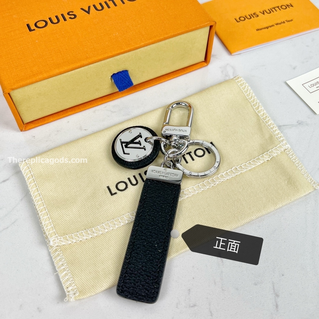 STEEL AND LEATHER BAG CHARM AND KEY HOLDER M00033