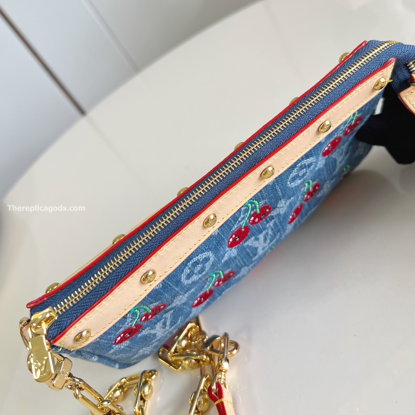 X TM POCHETTE ACCESSOIRES MONOGRAM CHERRY DENIM M13994