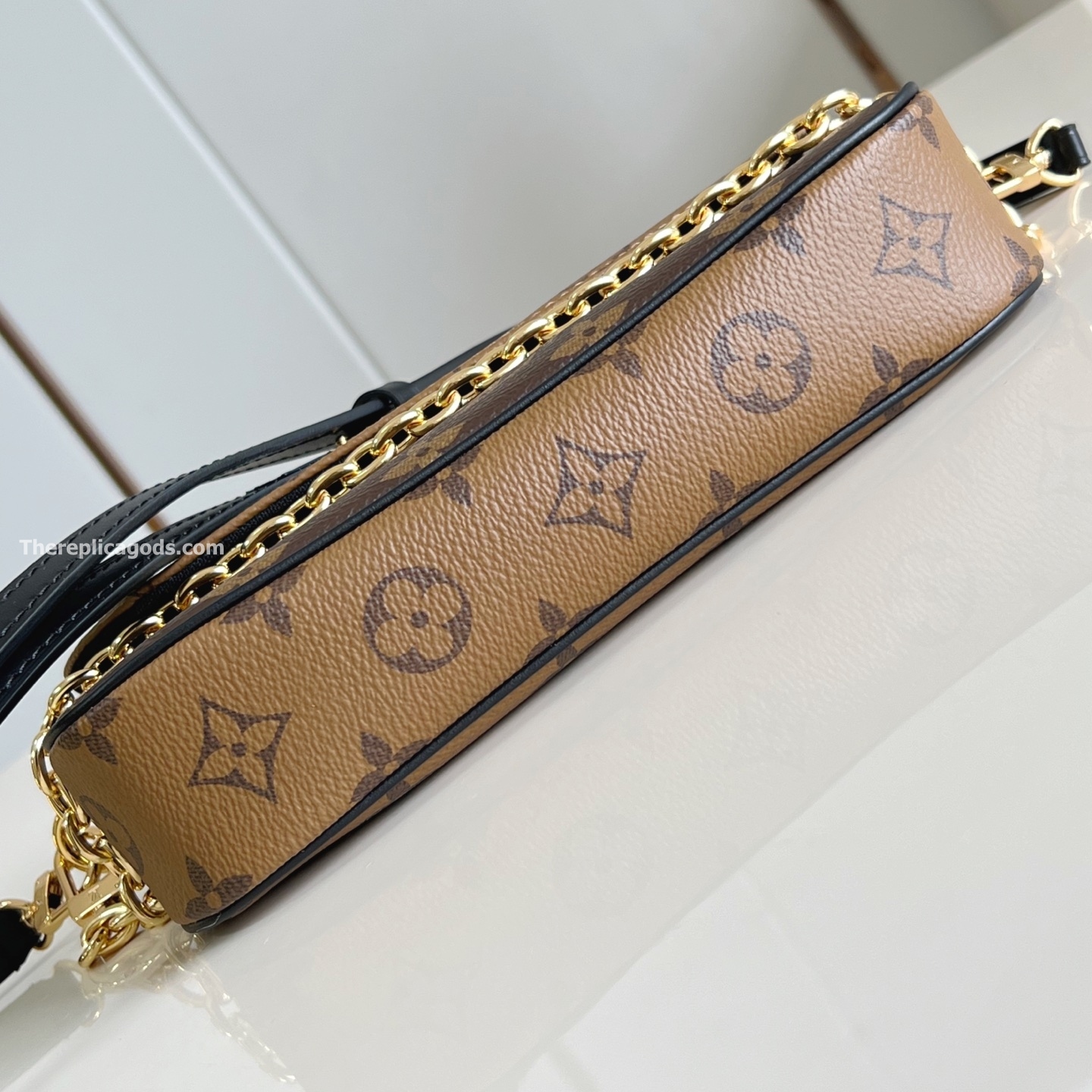 WALLET ON CHAIN IVY BROWN MONOGRAM REVERSE COATED CANVAS M26587