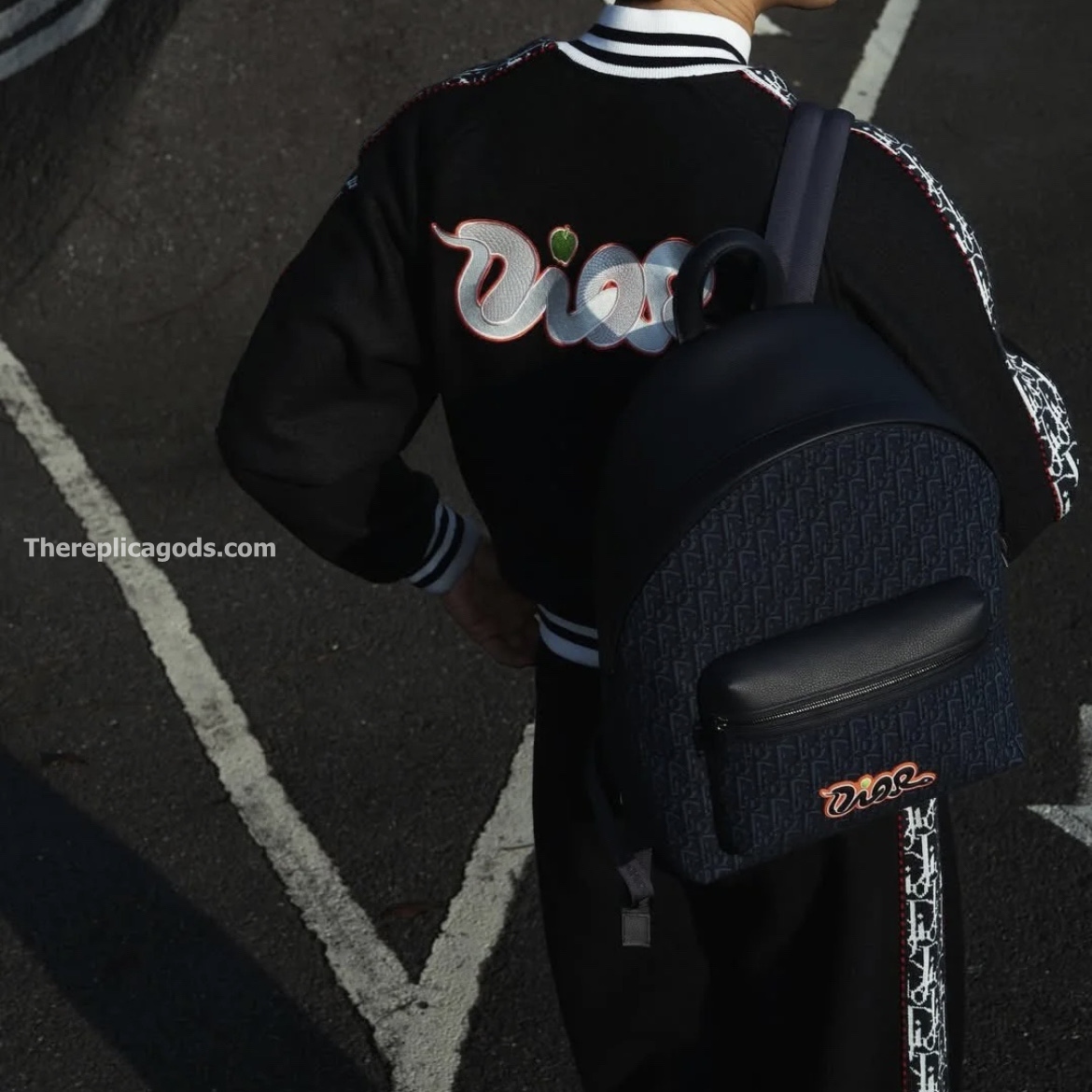 AND KAWS RIDER 2.0 ZIPPED BACKPACK NAVY BLUE GRAINED CALFSKIN AND OBLIQUE JACQUARD